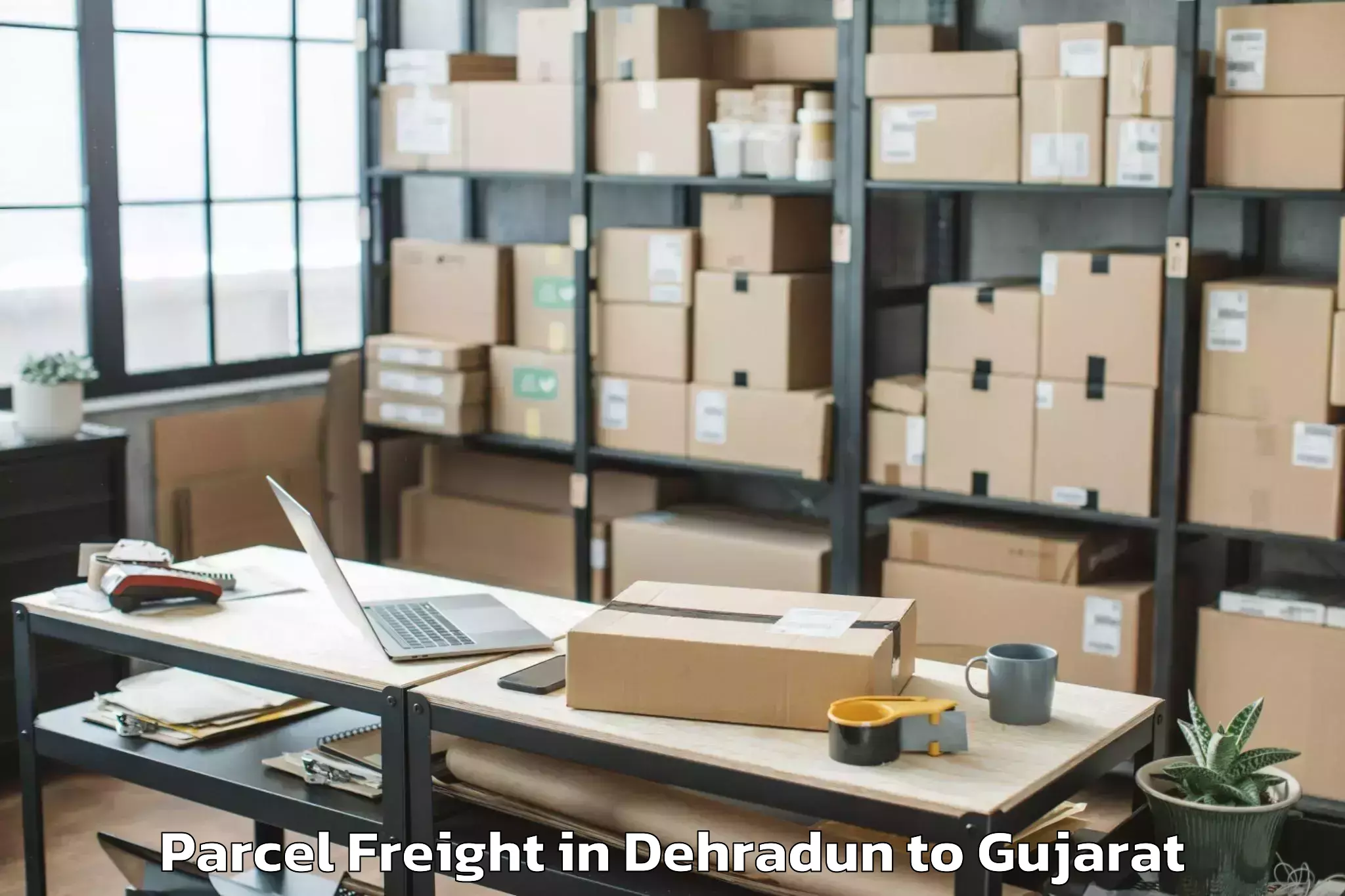 Quality Dehradun to Bilimora Parcel Freight